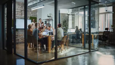 business professionals working at table together